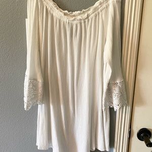 Off the shoulder blouse with lace on sleeves.